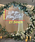 27.5 Inch Will You Marry Me Neon Sign With Dimmer Switch For Wedding Wall Decor, surrounded by floral wreath, lit LED display