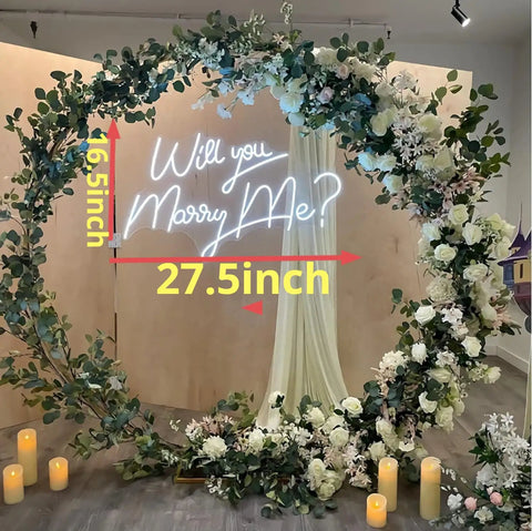 27.5 Inch Will You Marry Me Neon Sign With Dimmer Switch For Wedding Wall Decor, surrounded by floral wreath, lit LED display
