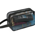 Portable mesh shower caddy bag with large capacity, heavy duty zipper, reinforced frame, filled with toiletries, side view.