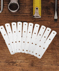 Heavy Duty Stainless Steel Corner Brackets With Screws No Tools Needed, Flat Metal Plates on wooden background with tools