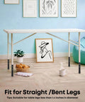 Heavy Duty Carbon Steel Table Leg Extenders Deliver Top Shelf Support For A Quick No Sweat Desk Lift That Kills Back Pain Cold With Simple Height Adjustments Up To Five Point Eight Inches Four Pack on a table in a bright room.