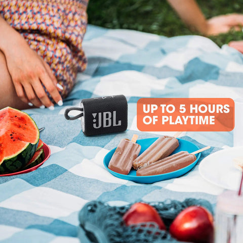 Go Anywhere Tiny But Mighty Mini Bluetooth Speaker With Big Sound And Punchy Bass on a picnic blanket