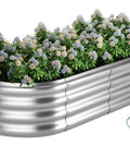 Raised Garden Bed 4x2x1 Foot For Outdoor Gardening Built To Last Designed For Vegetables And Flowers Galvanized Ground Planter Box Easy Assembly Corrosion Resistant Heavy Duty Metal Bed filled with plants.