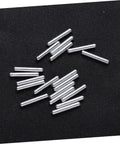 40 Piece 3x20mm DIY Short Drive Shafts For RC Robots And Micro Cars Kit, scattered on dark surface