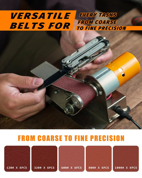 Mini electric belt sander with orange motor housing and red abrasive belt used for knife sharpening.