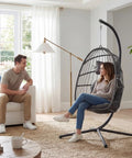 Indoor Outdoor Egg Chair With Stand For Patio And Balcony Wicker Swing Egg Chair Rust Resistant Steel Frame And Heavy Duty Stand Adjustable Suspension Chain 350 Lb Capacity Charcoal Grey shown in living room setup