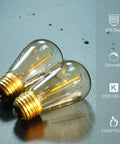 Close-up of 2 amber 2200K LED filament bulbs with E26 base, labeled dimmable and shatterproof, 25 Pack S14 String Light Bulbs Replacement