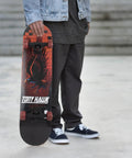 Person holding Tony Hawk skateboard with eagle graphic, an alternative to 31 Inch Pro Trucks Skateboard With Full Grip Tape And 9 Ply Maple Deck For Easy Cruising And All Skill Levels Signature Series Longboard Style Cruiser Built For Beginners To Pros