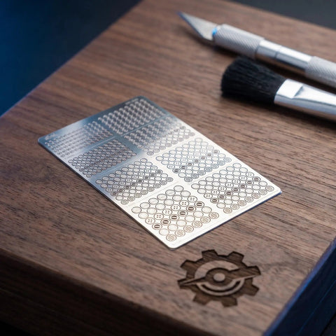 Metal Etching Tool Kit For Model Upgrades And Detailed Transformations, Pro Grade Hand Tools For Precise Etching On Plastic And Metal Kits, Heavy Duty Etching Set To Boost Your Build. Metal etch stencil card and hobby knife on wood board