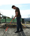 Person using 32-300RP 11 1 4 Inch Measuring Wheel With 5 Digit Ratchet Counter Rugged Beast Pro Grade Steel Frame on a construction site