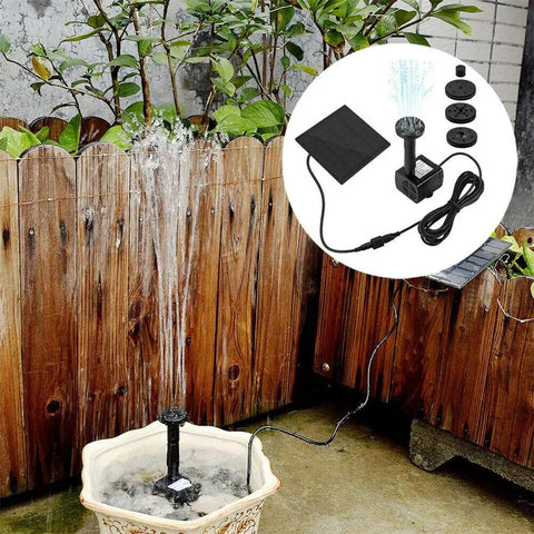 Solar Powered Fountain Kit For Bird Baths And Small Ponds No Wiring Easy Setup Outdoor Water Pump For Patio Gardens And Fish Tanks Eco Friendly Solar Panel Pump For Garden Water Features installed in bird bath with wood fence in background.
