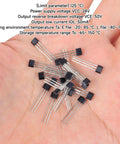 Top Shelf A3144 Hall Effect Sensors 20 Pack in hand with 3 pins for Arduino projects, black housing, compact design.