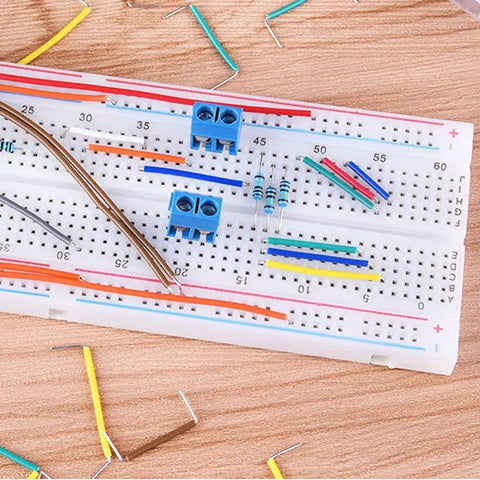 Breadboard with 840 Piece Jumper Wire Kit With 14 Length Values From 2mm To 125mm Solderless Flexible Breadboard Cables visible.
