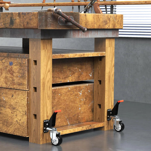 SPACEKEEPER workbench casters kit, two visible black and silver casters with orange levers on a wooden workbench.