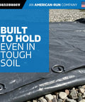 Image of landscape staples securing fabric in soil, showing Beefed Up Heavy Duty 6 Inch Landscape Staples With 8 Gauge Galvanized Circle Top Ground Pins For Weed Barrier Fabric Sod Turf Netting Erosion Control And Drip Irrigation Lines, Pack Of 100.