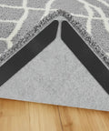 Two black 20 Pack Rug Grippers Non Slip Tape For Area Rugs On Hardwood Or Tile Floors Reusable Washable Double Sided Rug Pads