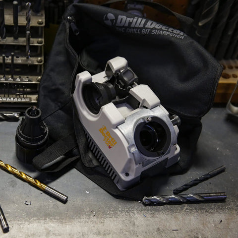 High Speed Portable Drill Bit Sharpener For Standard Twist Bits 3/32 To 3/4 Inch on workspace with drill bits and bag.