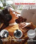 Woman relaxing on couch wearing semi open over ear studio headphones with 50mm neodymium drivers. Lightweight and comfortable.