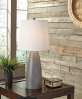 Shavontae Modern Table Lamps Set Of 2 27.5 Inch Gray Resin Bases With White Fabric Drum Shades on wooden table by window