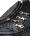 Handy Zipper Pull Replacement Kit For Small Holes With Detachable Tabs on black bag, assorted metal finishes, 4 pieces