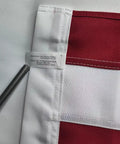 Close-up of edge stitching on Outdoor 3x5 Foot American Flag Built Tough Deluxe Heavy Duty Spun Polyester with sewn stripes tag visible.