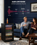 Couple in living room with 126 Can Beverage Refrigerator Cooler With Glass Door Mini Fridge For Home Bar Or Office That Hauls Beer Wine And Sodas Three Point Two Cubic Feet Of Chill Adjustable Removable Shelves In Eight Slots Black, showcasing low noise level.