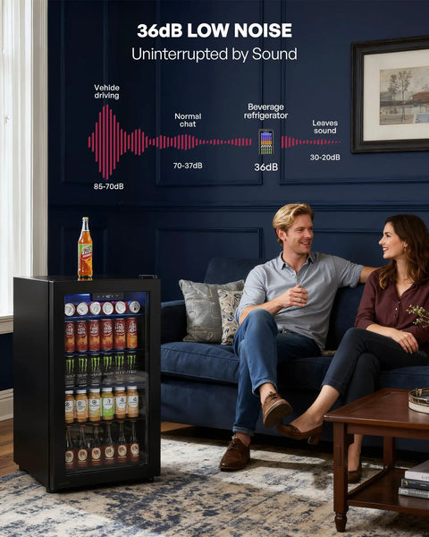 Couple in living room with 126 Can Beverage Refrigerator Cooler With Glass Door Mini Fridge For Home Bar Or Office That Hauls Beer Wine And Sodas Three Point Two Cubic Feet Of Chill Adjustable Removable Shelves In Eight Slots Black, showcasing low noise level.
