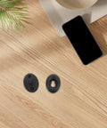 Top view of pro-grade quick-release wetsuit buckle connector set on wood table; includes black durable plastic and stainless steel replacement.