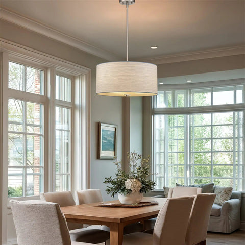 Pearl 18 Inch Modern 3 Light Drum Pendant Chandelier hanging over wooden dining table in bright living room