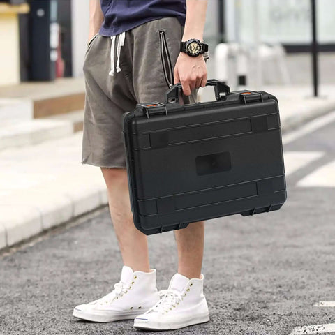 Rugged Hard Carrying Case With Thick Foam Padding For Pico Projectors And Tech Gear Built Different Shockproof Storage Box being carried.