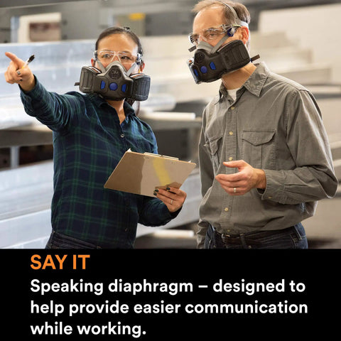 Two people wearing Half Face Respirator With Secure Click Fit Speaking Diaphragm And Push Button Seal Check Quad Flow Cartridges For Killer Breathability Pro Grade Comfort For Dust Sanding Grinding And Sawing HF802SD Medium, discussing in a workshop.