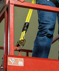 Person using Non Shock Absorbing Lanyard 4 Ft With Self Locking Steel Hooks Durable 1 Inch Nylon Webbing Label Cover OSHA And ANSI Compliant