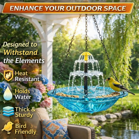 Solar Powered Hanging Bird Bath Fountain For Outdoors With Glass Bowl installed in garden with bird perched on edge.
