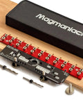 Hassle Free Cabinet Shelf Pin Jig Flips Between 5Mm And Quarter Inch Bits on wood board, showcasing drill bits and layout guides.