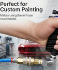 Person using Air Compressor Swivel Connector Kit With 360 Degree Quick Connect Fittings for custom painting in a workshop.