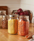Stainless Steel One Piece Mason Jar Lids Wide Mouth 6 Pack Airtight Seal Rust Resistant on jars with grains and pulses on kitchen counter