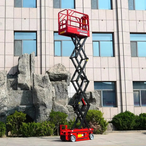 Industrial Scissor Lift Platform For Smooth Cargo Transfer And Equipment Maintenance Hydraulic Lifter raised against a building.