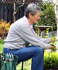 Person using 2-In-1 Garden Kneeler And Seat With EVA Foam Kneeling Pad And Removable Tool Pouch, Sturdy Steel Frame, No Assembly