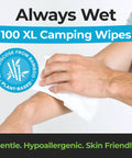 Person using XL Camping Body Wipes No Rinse For Outdoors on arm, showing plant-based and hypoallergenic features.