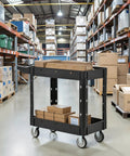 Heavy Duty Two Tier Rolling Utility Cart Built Like A Tank With Super Smooth Locking Casters Ergonomic Handle Supports Six Hundred Pounds in warehouse.