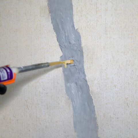 DIY Friendly Pro Grade Concrete Crack Injection Kit For Foundations Walls And Basements 5 Feet Long Injectable Filler in use on wall crack