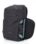 Urban Explore 30L Camera Backpack with open side pocket revealing interior gear storage, durable anthracite shell, carry on friendly.