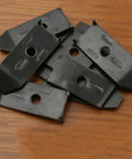 12 Sets Table Leaf Leveler Locks With Buttery Smooth Gliding Bars, Heavy Duty Extension Hardware Kit To Keep Your Drop Surfaces Rock Solid, Black metal latches laid on wooden table surface.
