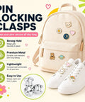 Locking Pin Backings Set for Enamel Pins and Badges, Heavy Duty Metal Clasps on a backpack and sneakers for secure pin display.