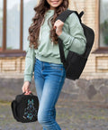 Girl holding a black daypack from Three 17 Inch Daypacks For Outdoor Camping Hiking And Travel 3 Pack Set Built For Group Trips