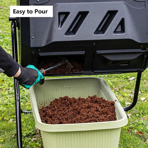 Close-up of 43 Gallon Dual Chamber Compost Tumbler With 360 Degree Tumbling For Fast Aeration And Nonstop Composting Dual Chamber Bin Built To Last For Kitchen Scraps And Yard Waste In Black with compost being poured into a bin.