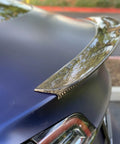 Close-up of Real Molded Carbon Fiber Matte Dry Look Spoiler For Tesla Model 3 showing lightweight aerodynamic design.