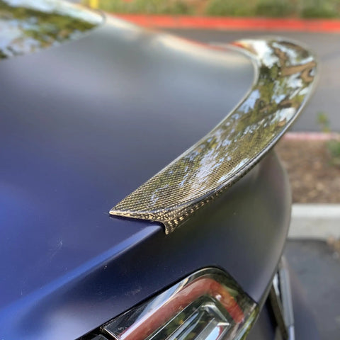 Close-up of Real Molded Carbon Fiber Matte Dry Look Spoiler For Tesla Model 3 showing lightweight aerodynamic design.