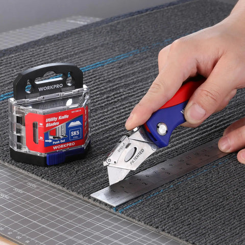50 Pack Utility Knife Blades With Dispenser, Razor Sharp SK5 Steel Refills in use cutting carpet with ruler guide