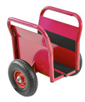 No Sweat Heavy Duty Panel Dolly Cart With One Thousand Pound Capacity And Ten Inch Reliable Solid Rubber Tires For Easy Drywall Loads Heavy Door Slides And Contractor Gear Runs In Glossy Red, rear view showing handles and tire.